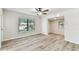 Bright living room with natural light, and laminate flooring at 6551 S West Shore Cir, Tampa, FL 33616