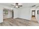 Open-concept living area with ceiling fan and laminate flooring at 6551 S West Shore Cir, Tampa, FL 33616