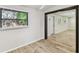 Living room with laminate flooring, and natural light at 6551 S West Shore Cir, Tampa, FL 33616