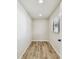 A bright room with neutral walls, recessed lighting, and wood-look flooring at 6551 S West Shore Cir, Tampa, FL 33616