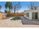Backyard pool area featuring a kidney-shaped pool with brick pavers and privacy fence at 709 Pruitt Dr, Madeira Beach, FL 33708