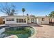 Backyard with pool, brick patio, and exterior view of the home at 709 Pruitt Dr, Madeira Beach, FL 33708