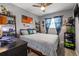 Unique bedroom with a bed, shelving units, and quirky decor with an american flag poster on the wall at 7307 34Th N Ave, St Petersburg, FL 33710