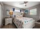 Comfortable bedroom with a ceiling fan, stylish furnishings, and a serene ambiance, featuring a patterned bedspread at 7307 34Th N Ave, St Petersburg, FL 33710