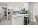Well-lit kitchen featuring stainless steel appliances, breakfast bar, and a modern design at 7307 34Th N Ave, St Petersburg, FL 33710