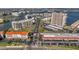 Aerial view of condo community with parking, tennis courts and water views in a desirable neighborhood at 7600 Sun Island S Dr # 407, South Pasadena, FL 33707