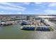 Striking aerial view of desirable condos offering stunning water views and lush tropical landscaping at 7600 Sun Island S Dr # 407, South Pasadena, FL 33707