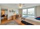 Bedroom featuring a water view, desk, and comfortable furniture for relaxing and working at 7600 Sun Island S Dr # 407, South Pasadena, FL 33707