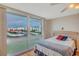 Bedroom with a bed and a view of the marina at 7600 Sun Island S Dr # 407, South Pasadena, FL 33707