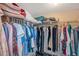 Walk-in closet showing clothing and linen with space for shoes on the floor below at 7600 Sun Island S Dr # 407, South Pasadena, FL 33707