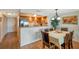 Dining area next to kitchen features hardwood floors and seating for six at 7600 Sun Island S Dr # 407, South Pasadena, FL 33707