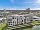 Stunning waterfront condo building with balconies overlooking beautiful landscape and water views at 7600 Sun Island S Dr # 407, South Pasadena, FL 33707