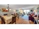 Spacious living room showcasing dining area, comfortable seating, and lots of natural light at 7600 Sun Island S Dr # 407, South Pasadena, FL 33707