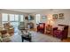 Cozy living room featuring comfortable seating, a large window, and stylish decor for relaxed living at 7600 Sun Island S Dr # 407, South Pasadena, FL 33707