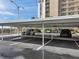 Covered parking featuring assigned parking spots with multiple vehicles parked at 7600 Sun Island S Dr # 407, South Pasadena, FL 33707