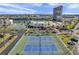 Wide angle shot of tennis courts with other recreational amenities and water views at 7600 Sun Island S Dr # 407, South Pasadena, FL 33707