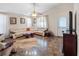 Bright living room with stylish seating, ceiling fan, and luxurious marble flooring at 7712 40Th N Ter, St Petersburg, FL 33709