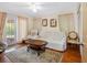 Inviting living room with natural light and comfortable seating and an area rug at 7712 40Th N Ter, St Petersburg, FL 33709