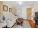 Inviting living room with natural light and comfortable seating and an area rug at 7712 40Th N Ter, St Petersburg, FL 33709