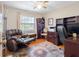 Functional home office with a bookshelf, desk and reclining chair at 7712 40Th N Ter, St Petersburg, FL 33709
