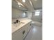 Updated bathroom with tub shower combo with marble vanity, modern hardware and neutral tiling at 7831 Red Run Dr, Port Richey, FL 34668