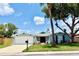 Charming one-story home featuring a freshly painted exterior, new roof, landscaped yard, and a two car garage at 7831 Red Run Dr, Port Richey, FL 34668
