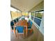 Spacious screened patio perfect for outdoor dining, featuring a table with seating for six at 7831 Red Run Dr, Port Richey, FL 34668
