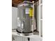 Performance Rheem water heater with $49 energy guide on a shelf at 7831 Red Run Dr, Port Richey, FL 34668