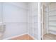 Walk-in closet with shelving and a peek into the bathroom at 800 S Dakota Ave # 429, Tampa, FL 33606