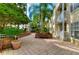 Landscaped courtyard with benches, creating a serene and inviting outdoor space for residents in Hyde Park Walk at 800 S Dakota Ave # 429, Tampa, FL 33606