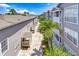 An exterior view of the building with palm trees and beautiful landscaping at 800 S Dakota Ave # 429, Tampa, FL 33606