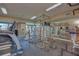 A community gym featuring modern exercise equipment, weight machines, and mirrored walls at 800 S Dakota Ave # 429, Tampa, FL 33606