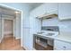 A kitchen showcasing a white refrigerator, stove, oven and tile backsplash at 800 S Dakota Ave # 429, Tampa, FL 33606