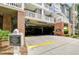 Exterior of the parking garage, including guest parking and multiple stories with a white railing at 800 S Dakota Ave # 429, Tampa, FL 33606