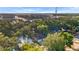 Aerial view of the house, showcasing its proximity to surrounding trees and neighborhood amenities at 8112 N 10Th St, Tampa, FL 33604
