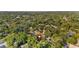 Drone image pinpointing the house location within a lush, tree-filled neighborhood at 8112 N 10Th St, Tampa, FL 33604