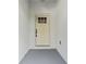 A welcoming front door with glass window grids offers natural light in a modern home at 8112 N 10Th St, Tampa, FL 33604
