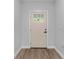 A modern front door with glass windows and clean lines complements the home's interior at 8112 N 10Th St, Tampa, FL 33604