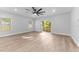 Spacious living room with lots of natural light and wood floors at 8112 N 10Th St, Tampa, FL 33604
