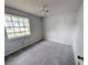 Cozy bedroom featuring plush carpeting and natural light at 8209 Volusia Pl, Tampa, FL 33637