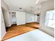 Open-concept living space with windows, laminate flooring and grey walls at 8209 Volusia Pl, Tampa, FL 33637