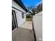 Back patio featuring a modern white fence at 8209 Volusia Pl, Tampa, FL 33637