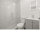 Bathroom with modern fixtures, walk-in shower with new tiling, shower head and vanity at 8215 N 14Th St, Tampa, FL 33604