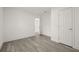 Bedroom with new flooring, fresh paint, and trim at 8215 N 14Th St, Tampa, FL 33604