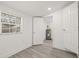Bedroom with an open doorway, showing view of a water heater in another room at 8215 N 14Th St, Tampa, FL 33604