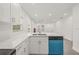Bright open kitchen with white subway tile backsplash, quartz countertops, and a stainless steel kitchen faucet at 8215 N 14Th St, Tampa, FL 33604