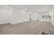 Spacious living area with recessed lighting, seamlessly connected to modern kitchen at 8215 N 14Th St, Tampa, FL 33604