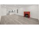Bright living room with fireplace and view of kitchen, creating open living concept at 8215 N 14Th St, Tampa, FL 33604