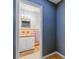 Charming half-bathroom featuring tiled floors and walls, vanity, and sink at 8525 N Ola Ave, Tampa, FL 33604