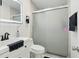 Modern bathroom with sleek sink vanity, glass shower, and contemporary fixtures at 8525 N Ola Ave, Tampa, FL 33604